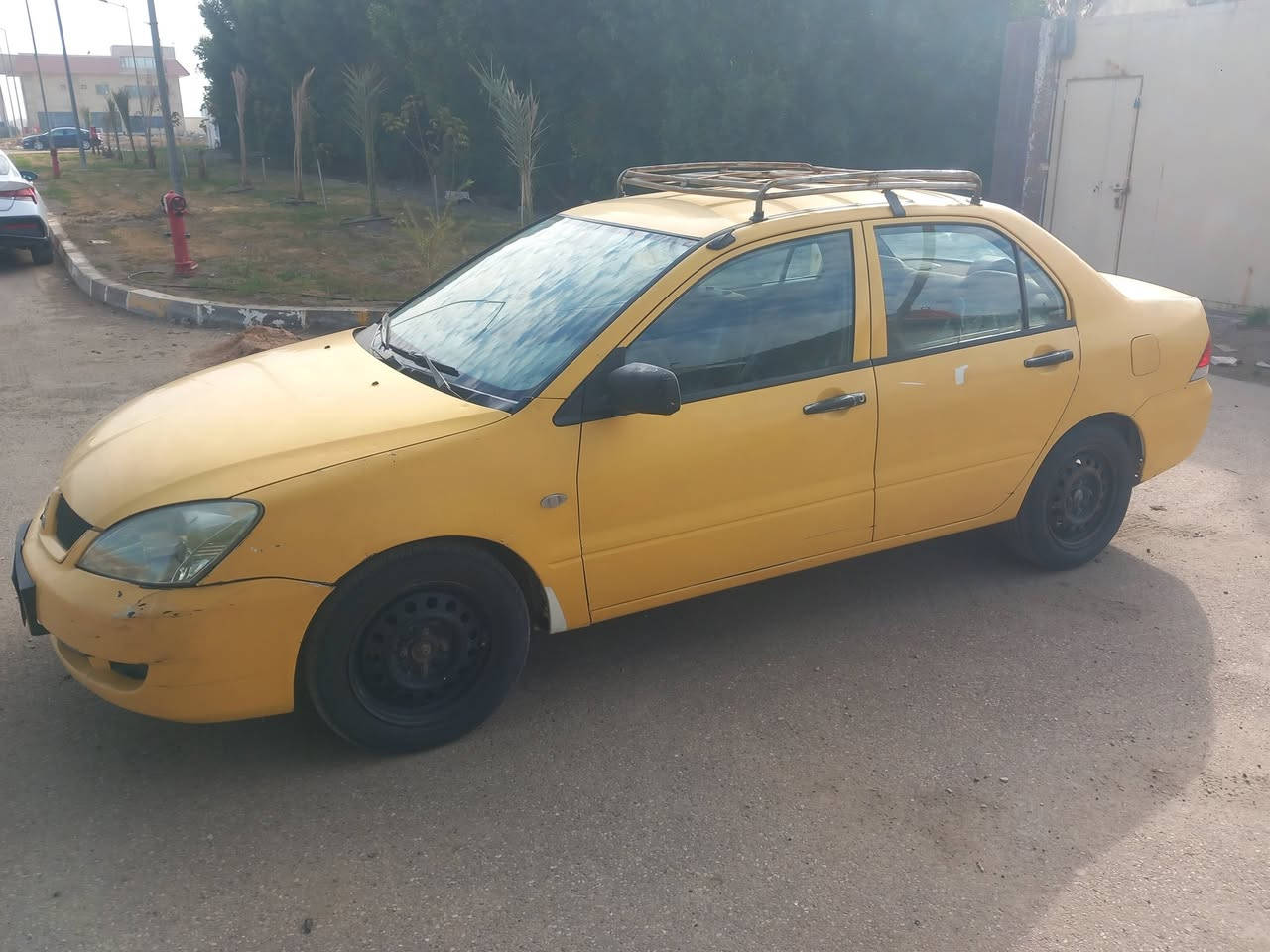 السلام عليكم 
لانسر ٢٠٠٩ 
السياره بسمي ثاني يوم تحويل 
كير اوتو  
سيار خير من الله 
تبريد شغال  تخم تاير جواه 
باتري جديد
بيه ملاحظات 
سعر ٥٥ وبيه مجال بسيط 
للتواصل هذا رقمي 
***********
