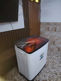 غسالة ١٤ كيلو • غسيل وتنشيف • توصيل بغداد