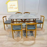 طاولة مرمر • دوشمة جلد • ٦ كراسي