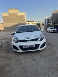 كيا ريو 2013  امريكي  رقم ذي قار حادث جاملغ وباب  السيارة باسمي موصفات...