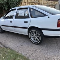 اوبل فكترا جنطه رقم نينوى موديل1991 لون ابيض سنويه بأسمي رقم مسطره الا...