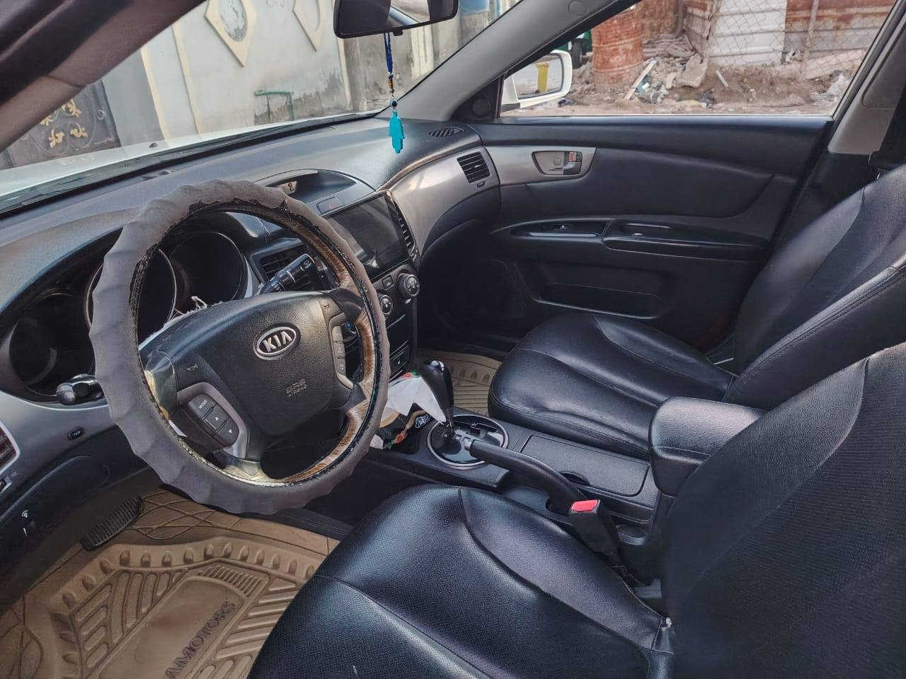 كيا اوبتيما ٢٠٠٩ السونار مرفق بلصور السعر ١١٠ السنوية بسمي *********** الميمونة, ميسان
