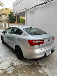 كيا ريو للبيع 1600 وارد امريكي رقم بغداد الانكليزي مصفر هيئة وغرامات و...