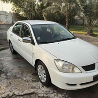 لانسر موديل 2011 للبيع سياره جديده محرك 1500مكان السيارة بغداد السعر 8...