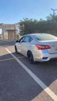 نيسان سنترا ٢٠١٦ للبيع  بصمة  رادارات جانبية  كامرة  كشنات جلد كهرباء ...