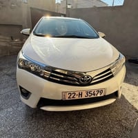 كورلا 2014 ( زيرووووو ) سياره ماشيه ١٦ الف سياره زيره بيهه  طخه خفيفه ...