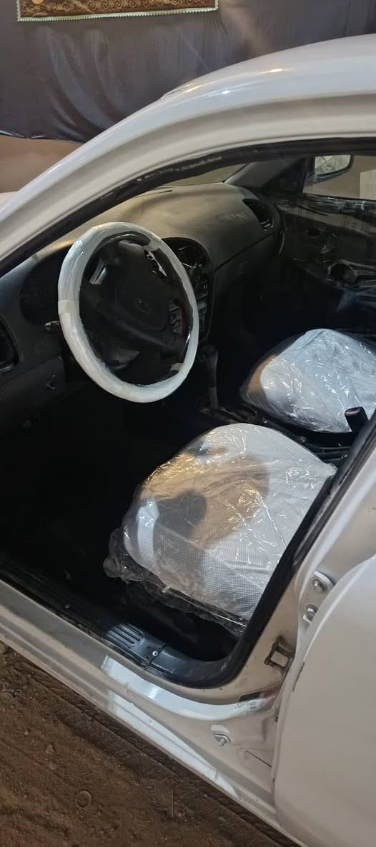 دايو نوبرا 1 مديل 99
‏سيارا بسمي رقم انكليزي هزا جديدة
‏كير ومحرك  كورلا ... اوتماتيك 
‏مفروشة عازل صوت وعازل حراري 
‏سنتر لك جديد 
‏ضغيره كامله جديده
‏حداديه حلوه 
‏تنكجيه كامله على اخر حبايه
‏مصبوغة عام داخل وخارج  فرن
‏ويالة مصبوغات وكاملات 
‏ضايفلها حساس بك 
‏للستفسار ***********
‏مكان السيارة نجف حي الزهراء
‏ النجف, العراق
