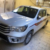 هايلوكس 2025 زيرو ماشيه 100كيلوو  كفاله رقم بغداد  مرقم كامل  عنوانه ب...