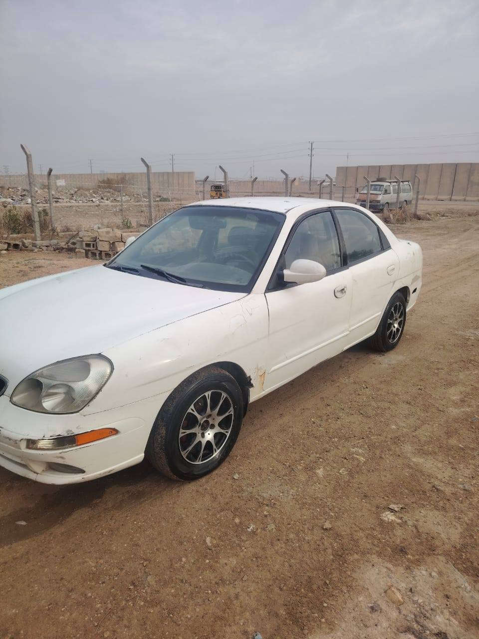 نوبرا موديل ٢٠٠١ أمريكي وارد خليجي داخله هزه وتجديد سنويه بتاريخ ٢٠٢٦/١/٢٤ يعني السنويه تسقط لغايه ٢٠٣١ محرك وكير أوتوماتيك قطع حاويه قبل سنه ونص مبدله بيهه ضربه بالتكمه اليمين ومصلحه فقط بيهه تلحيظات بسيطه السعر مخلصهه ٣٠$ المكان بغداد هذا الرقم بيه  واتساب ***********
