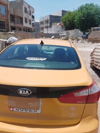 للبيع كيا فورتي تكسي وارد امريكا رقم بغداد حديث سنويه جديد موديل 2014م...