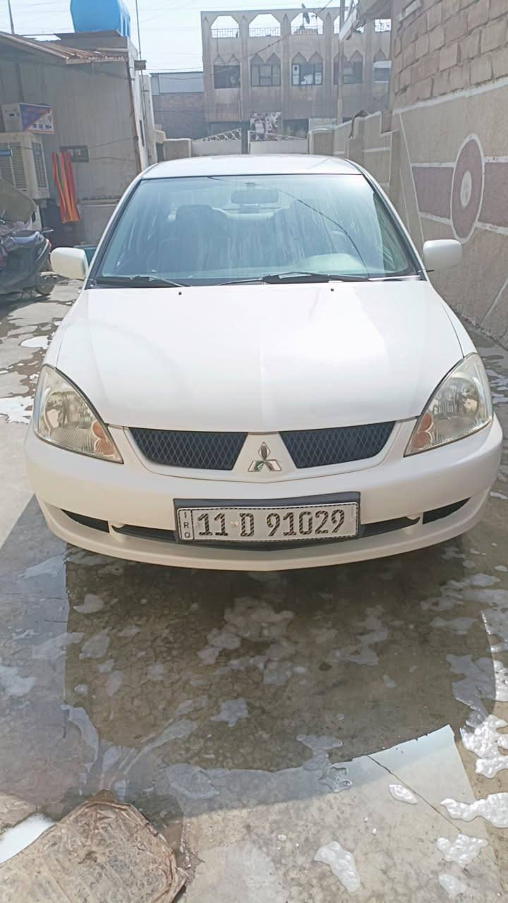 لانسر 2011 كير ومحرك مكفول ماشيه ١٣٩ السعر ٩٨ المكان  بغداد الشعب ***********
