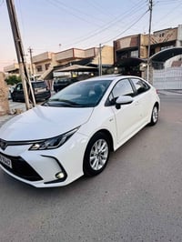 كورلا هايبرد 2025 ماشية 8 الاف كفالة عامة السعر 155$ مكاني بغداد الكرخ...