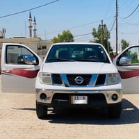 نيسان نيڤارة 2009 • أبيض بدون صبغ • كوبون بنزين