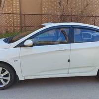 اكسن 2011 رقم بغداد بسمي منظومه غاز كبون بيها  صبغ باب خلفي وجاملغ اما...