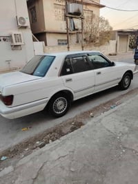 سيدان للبيع موديل 1990 رقم بغداد الجديد بسمي الون ابيض تشغيل عن بعد  ت...