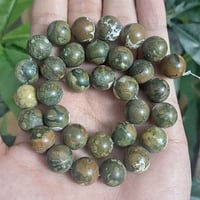 عقد گامبابا • أحجار طبيعية • توصيل جنيڤ