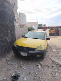 لانسر البيع مديل 2010 كير عادي سعر 60 اوبيه مجال 07706306482