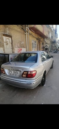 نيسان سني ياباني موديل 2000  كير و محرك مكفولات  بدون دواخل تبريد قوي ...
