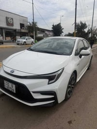 كورلا ٢٠٢٤ s هايبرد ماشيه ١٨ ألف  مكفوله من صبغ ولبارد  فتحه.  بصمه كش...