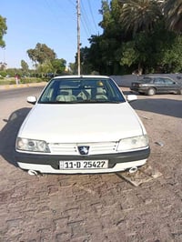 بيجو 405  موديل 2010 لون ابيض رقم (بغداد الدولي باسمي تحويل مباشر غرام...