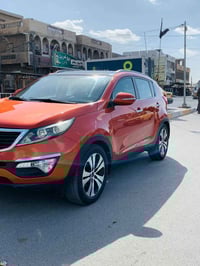 سياره لبيع سبورتج موديل ٢٠١٤ خليجي اربيل دولي الون مشمشي مكفوله من صبغ...