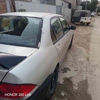 ميسبوشي لانسر  خصوصي رقم بغداد انكليزي مكفوله من صبغ وضربه فقط جنطه بي...