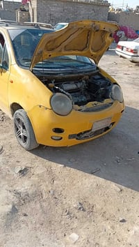 كيو كيو • مكينة وكير بالكرتون • رقم بغداد