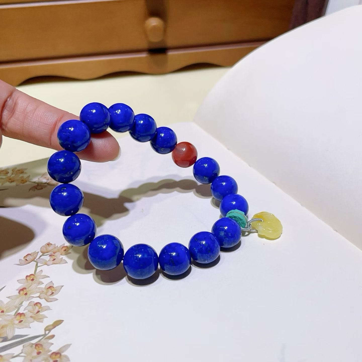 Natural Lapis Lazuli Bracelet

Fine jewelry is more than just an accessory; it serves as the switch that sets the tone for your mood each day.

Today, I’m sharing a "stunning tri-color" combination that is sure to captivate you at first glance:
🔹 Natural Lapis Lazuli: Pure blue with minimal white veining and sparse gold flecks, it resembles a starry midnight sky, exuding an innate aura of mystery and nobility. It acts as your anchor, helping you maintain your composure and stand out effortlessly amidst the crowd.

🔹 Nanhong Agate: That rich, deep "persimmon red" hue is reminiscent of the warm sunshine on a winter's day. It works wonders for brightening your complexion—for those with warmer skin tones, wearing it instantly makes your skin appear two shades fairer.

🔹 Amber: Possessing a soft, creamy-yellow texture, it feels like time itself has been crystallized. Serving as a transitional shade, it harmonizes the cool tones of the Lapis Lazuli with the vibrant intensity of the Nanhong Agate.

The interplay of blue, red, and yellow creates a fusion that captures both the romance of French aesthetics and a touch of vintage Chinese charm.

無論是通勤的襯衫，還是週末的一襲長裙，它都是手腕上最吸睛的存在。

If you would like this subtle beauty to become your daily companion, write to me 
📩WhatsApp：8613308361107

Don't wait, because a bracelet like this will probably never appear again


**إذا كنت صاحب هذا الإعلان وتريد حذفه لأي سبب، رجاءا أرسل رسالة إلى الدعم الفني**