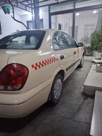 نیسان سەنی مۆدێل 2005 گێڕو مەکینە بەشەرت لێدانی کەمی پێشی هەیە گێڕعادی...