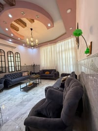 النجف حي الزهراء • دار 100م • طابقين غرفتين