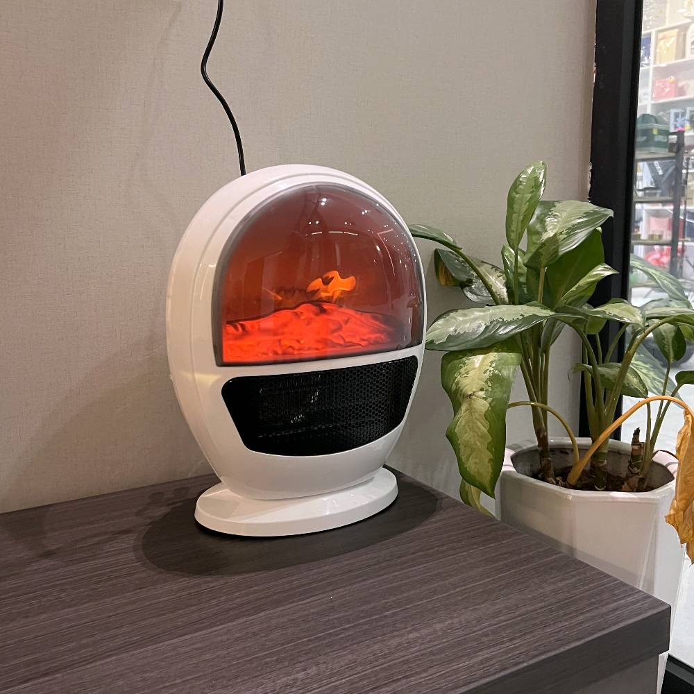 � مدفأة فاخرة بتصميم لهب واقعي – دفا وجو بنفس الوقت! 🔥

حوّل برودة الشتاء إلى دفء مريح مع هذه المدفأة الأنيقة ذات التصميم العصري الشبيه بالكبسولة الفضائية.
تجمع بين حرارة قوية وإضاءة لهب ثلاثية الأبعاد تمنح المكان لمسة دافئة وفاخرة.

✨ المميزات:
	•	🔥 تأثير لهب واقعي يخلق أجواء مريحة وساحرة في أي غرفة.
	•	💨 تسخين سريع بفضل شبكة التدفئة الأمامية عالية الأداء.
	•	🔇 هادئة جدًا – مناسبة لغرف النوم والمكاتب.
	•	⚡ استهلاك منخفض للطاقة مقارنة بالمدافئ التقليدية.
	•	🔒 آمنة ومزودة بقاعدة ثابتة تمنع الانزلاق ومؤشر تحذير.
	•	🎨 تصميم أنيق يضيف لمسة ديكور حديثة لأي مساحة.

💡 مثالية لـ: غرف النوم – الصالات – المكاتب – الكافيهات – الديكور الشتوي.

✨ دفا… وذوق… ونور لهب يخلي الجو أحلى