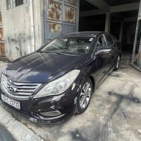 ازيرا 2011 موصفات فول  لون باذنجاني ضرر نفس الموضح بل صوره وبيها صندوك...