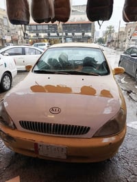 كيه ريو 2001سياره جاهره عايزه بس صبغ داير جاملغ مشروع وطني عليه هيأه 3...