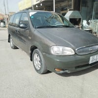 كيا كارنفال • ٢٠٠٠ • رقم بغداد باسمي