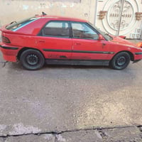 مازدا 323 • ١٩٩١ • موصل