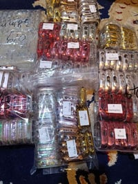 حافظات ساعات ٣٣٠ • لاصق شاشة ١٥٥٠ • شحن DHL