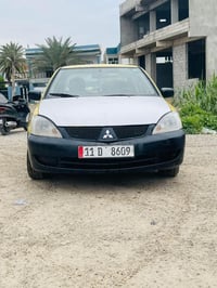 لانسر ٢٠١٠ • محرك ٢٠٠٠ • رقم بغداد ٢٠٢٧