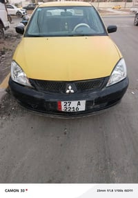 ميستبوشي لانسر 2007 مصفره هيئه وغرامة بيه ضربة بل صندوك بس ما وصل للحو...