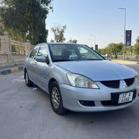 لانسر ٢٠٠٦ • رقم مميز • باب صبغ
