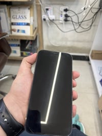 12 Pro max  الذاكرة 512 البطارية 77% الجهاز مستبدل بي شاشة وبيها ضربات...