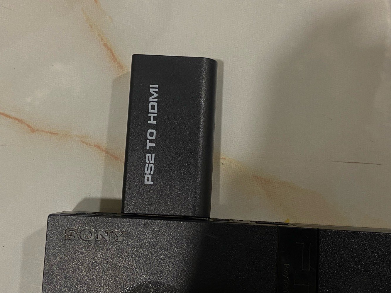 PS2 SLIM للبيع 
النظافة كدامك بس بيه خلل بزر التشغيل تحتاج تبديل 
مع يدتين سلك ويده بلوتوث 
كامل ملحقات موجودة البور وسلك av 
ومحوله hdmi يعني تكدر تشغل الجهاز على تلفزيون حديث ووياه سلكين hdmi 
وميموري كارد 2 مهكر 
قيمه وتدلل 
شنو موديل البلايستيشن بالضبط؟ وهل هو معدل/مفكوك أو شغال عالـدسك والفلاشة؟: 
ps2 slim معدل يشغل الفلاش بس ميشغل اقراص ينرادله عدسه 
شلون حالته التشغيلية: الجهاز واليدات كلهم شغالين زين لو أكو ملاحظة على أي يد أو منفذ؟: 
الجهاز يحتاجله تبديل قطعة التشغيل  يده بلوتوث شغاله واليدتين السلك ايضا 
كل الملحقات الظاهرة بالصور داخلة بالسعر لو أكو شي منّها مو مرفق؟: 
كل الملحقات ماعدا واير الطاقة بس موجود بس ماصورته  
وين موقعك بالضبط بالإمارات/العراق حتى نرتب الاستلام؟ وهل تقبل توصيل؟: 
العراق ، توصيل ماكو 
السعر كم نهائي؟ وهل أكو مجال بسيط بالنزول إذا الدفع فوري؟: 
ماعندي سعر محدد قيم واخده 