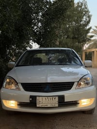 لانسر 2010 للبيع بيها صبغ جاملغ وبنيد ودواير الجاملغات الخلفيه  مكينه ...