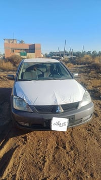 لانسر ٢٠١٠ • تايرات بطارية جديدة • راديتر نازف