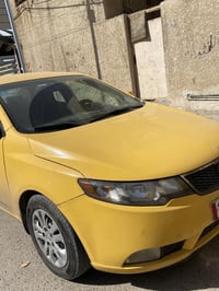 Kia فورتي 2013 فول تحكمات مقود حساسات خلفيه تخم تاير جديد السياره باسم...