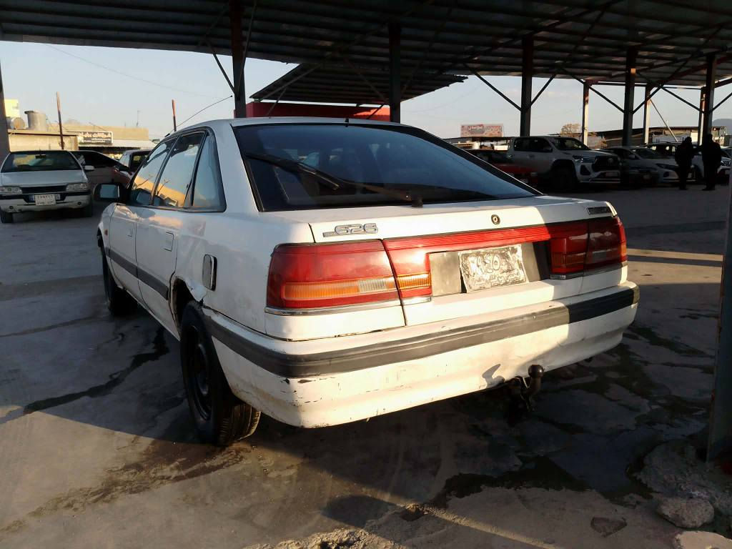 مازدا 8 و به غ
1992 
***********
***********
ارمي كوني اسايش 
به شه رتي اوليات
گيرو مه كينه ي به شه رت 
تايه ي تازه يه 
من كينه ي لوكي بو بن ستراوه 
سليماني هه واري شار 
ناوي زور جوان 
15 معامه له السليمانية, العراق
