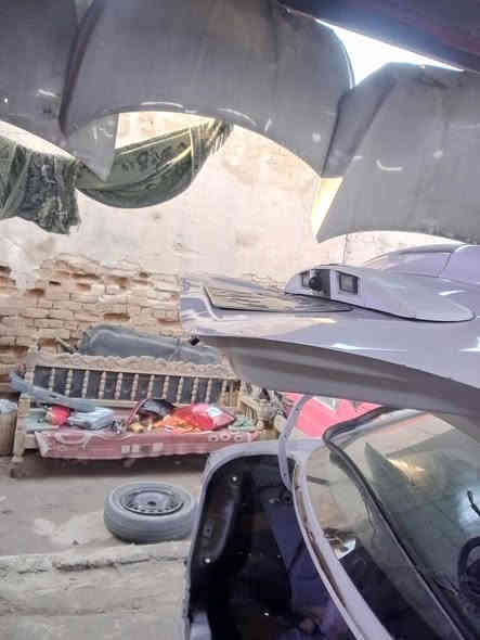 تعديل الجنطه الخلفية والجاملغ الأيمن على البارد وتكعيد ظهر سياره نيسان سني قبل وبعد الإنتهاء منها 
سمكره وفابير كلاس سيارات حديثه باادراه حيدر السمكري بغداد هاتف ***********
