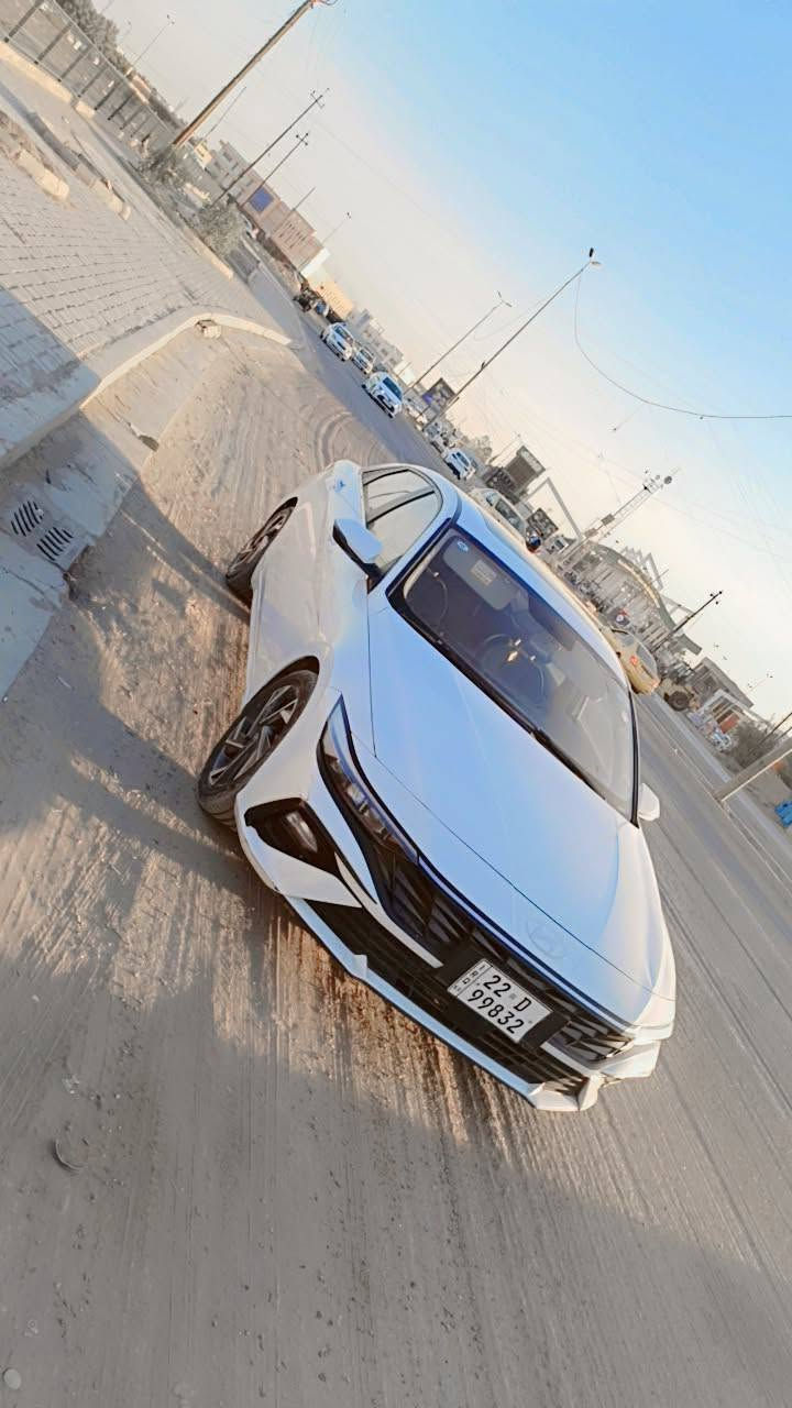 هيونداي النترا 2024 (خليجي - تجميع صيني) - فول مواصفات 1/1 💎
​السيارة بحالة الوكالة (ماشية 70ألف كم فقط) وكفالة عامة   ( السونار مرفق مع المنشور وشرط الفحص).
​📌 أبرز المواصفات:
​المحرك والكير: محرك وكير شرط الفحص (كير طيارة). محرك15000دبل نوزل 
​أنظمة القيادة: 4 مودات قيادة (Eco, Comfort, Smart, Sport).
​المظهر والاضاءة: لايت LED نهاري + زنون عالي ناصي (3 عدسات) + ويل رياضي حجم 17.
​الداخلية والراحة: فتحة سقف (سلايد) + مقاعد جلد أسود + ستيرن رياضي + تبريد قطعتين (ثلج 🥶) + شاشة أصلية وعداد ديجيتال.
​الأمان والأنظمة: 6 إيرباك (دشبول، دركة، تكم، مقاعد) + سايد بريك كهربائي (بصمة) + حساسات خلفية وكاميرا + كروز سرعة وتحكم ستيرن فول.
​التحكم: بصمة تشغيل وبصمة أبواب + مري شفط كهرباء مع إشارات.
​💸 السعر: 138 ورقة (وبيها مجال بسيط للشراي الطيب).
📍 الموقع: بغداد - البياع / الشرطة الخامسة. او منطقه حي العامل 
​📞 للتواصل والاستفسار:
​اتصال ***********
