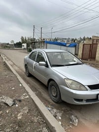 السياره مغاسلها شارعنه طين  للبيع لانسر موديل 2010 محرك 1500 قبق اسود ...