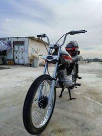 دراجة • مكينة سي جي • شاصي 23