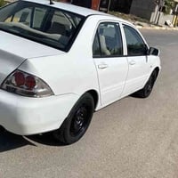 لانسر 2011 رقم بغداد كير محرك صدر تخم تاير جديد  السياره جاهزه سنويه 3...